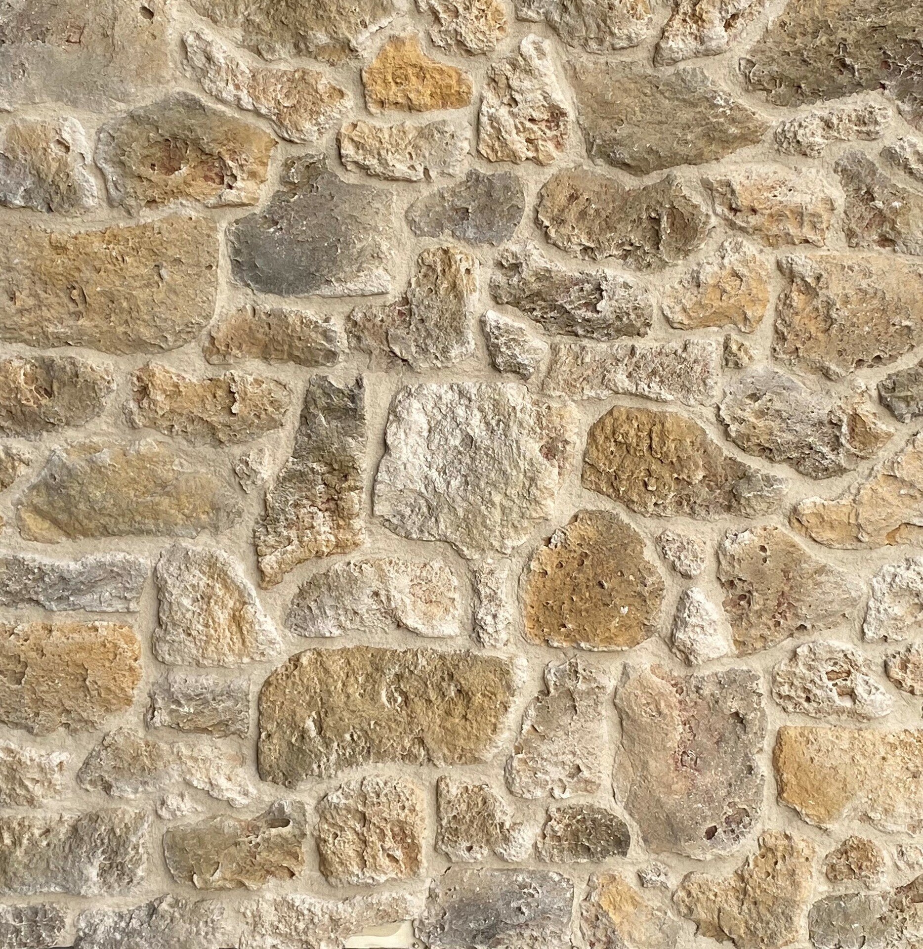 Parement pierre de meulière ton ocre jaune